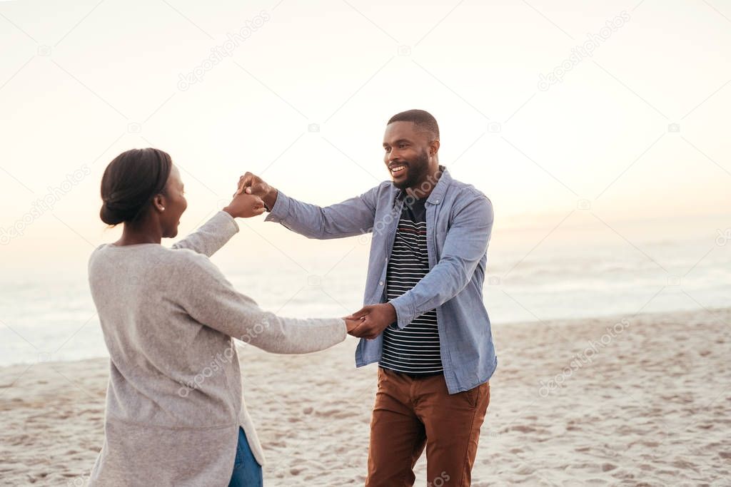 couple smiling and dancing 