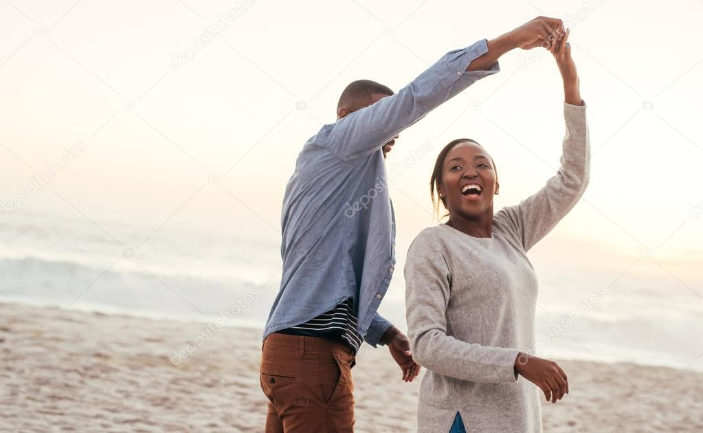  African couple playful dancing 