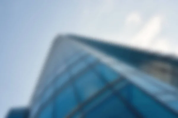 Imagem Desfocada Exterior Vidro Arranha Céu Moderno Contra Céu Azul — Fotografia de Stock