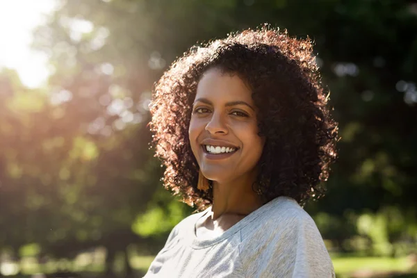 Portrait Smiling Young Woman Curly Hair Standing Park Sunny Summer — Stock Photo, Image