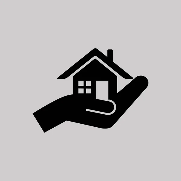 Inmobiliaria en icono de la mano — Archivo Imágenes Vectoriales