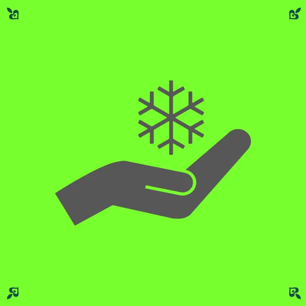 Sněhová vločka a ruku ikona — Stockový vektor