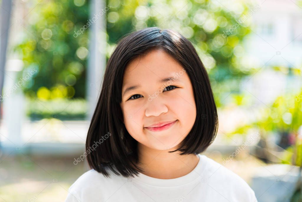 Close up of happy asian girls smiling.