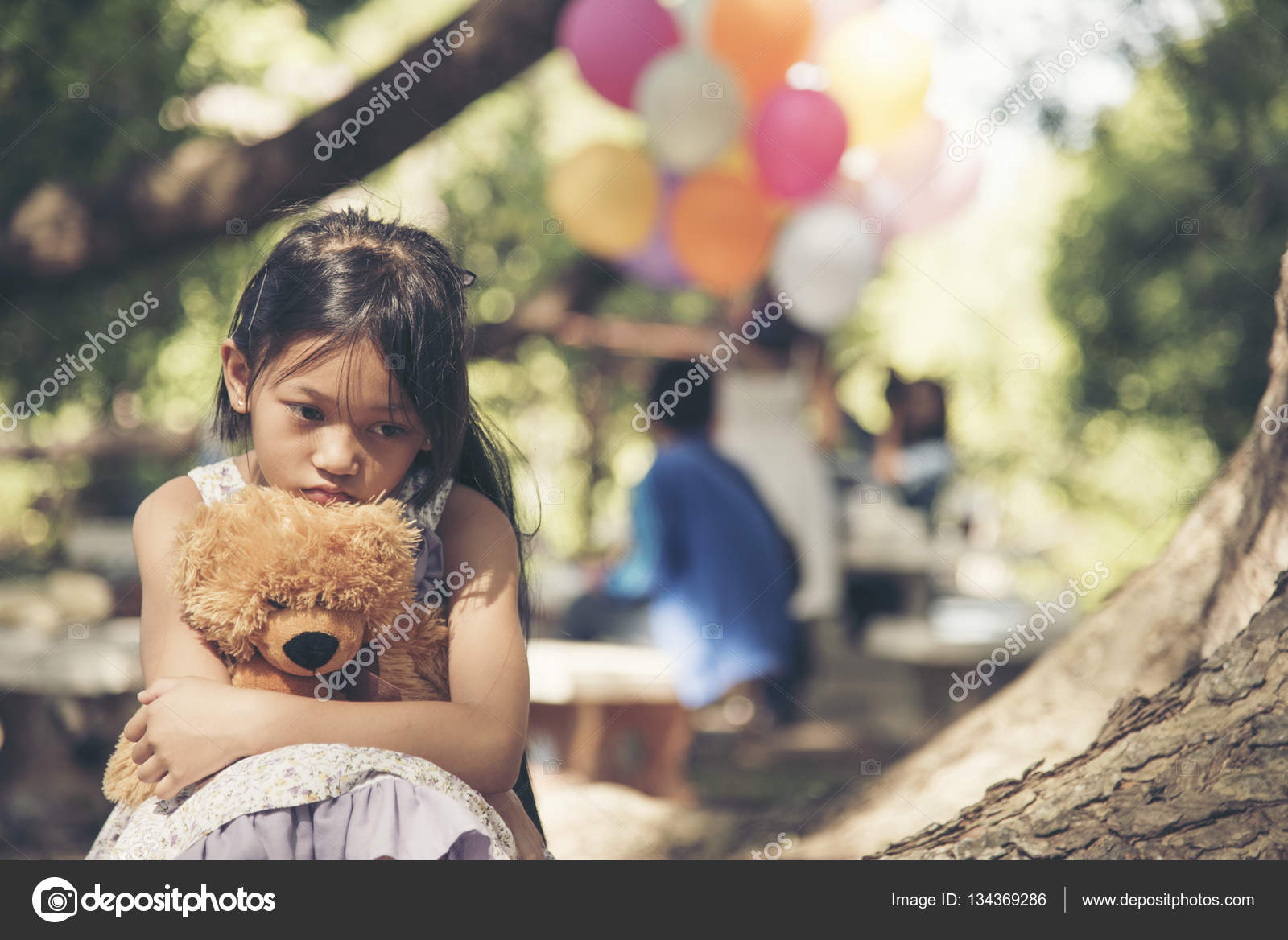 Sad girl feeling alone in the park concept.Lonely beautiful ...