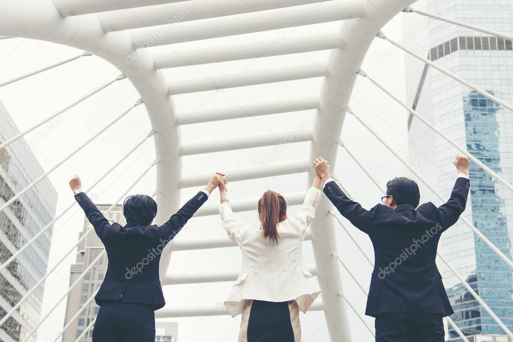 Teamwork Together Concept. Group of diversity people high five on air to greeting power of tag team. Multiethnic people group working togetherness. Volunteer collaboration in Business Team success