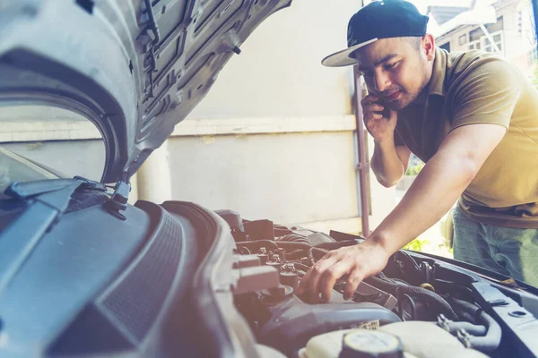 Mechanic Car Service in automobile garage auto car and vehicles service mechanical engineering. Automobile mechanic hands car repairs automotive technician workshop center. Services car engine machine
