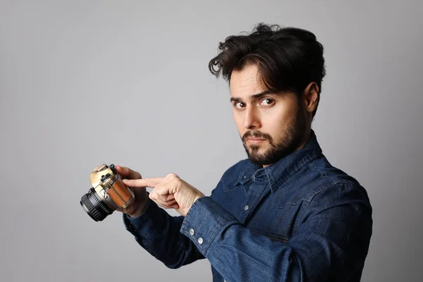 Young bearded hipster blogger posing on the white background. Isolated — Stock Photo, Image