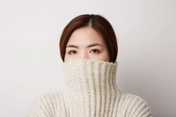 Close-up portrait of Chinese young woman posing on the white background. Isolated. — ストック写真