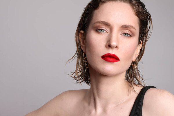 Horizontal portrait of attractive and sexy girl posing in the studio.