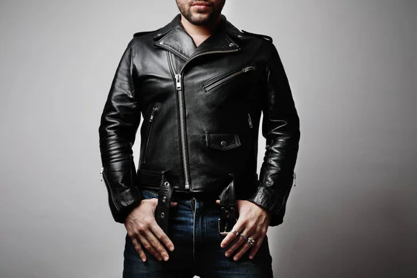 Mock-up of man wearing leather jacket stands frontal in the studio. Horizontal. — Stock Photo, Image