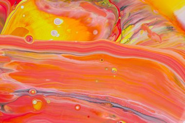 Kırmızı ve sarı tonlarda akrilik boyanın soyut arkaplanı