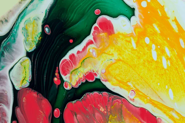 Abstract background of acrylic paint in red and green tones