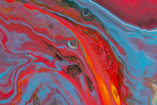 Abstract background of acrylic paint in red and blue tones