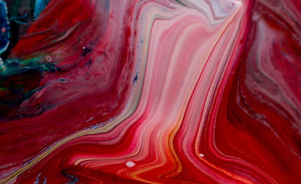 Abstract background of acrylic paint in red tones