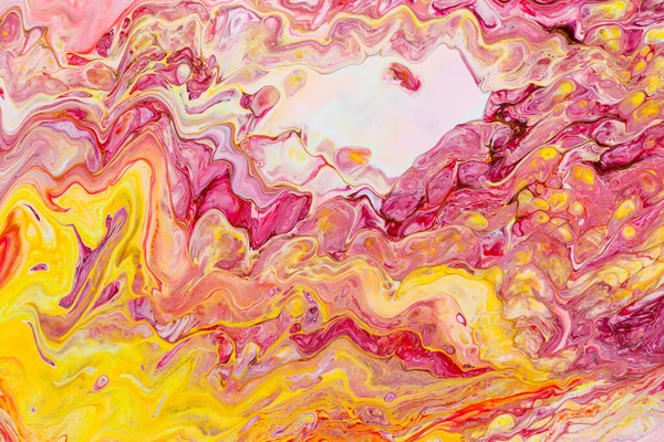 Abstract background of acrylic paint in red and yellow tones