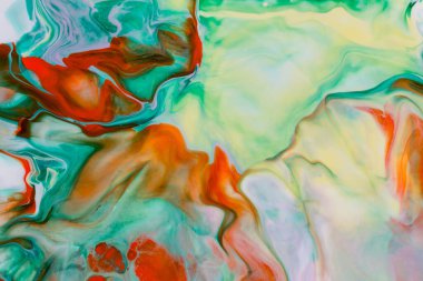 Yeşil ve turuncu tonlarda akrilik boyanın soyut arkaplanı