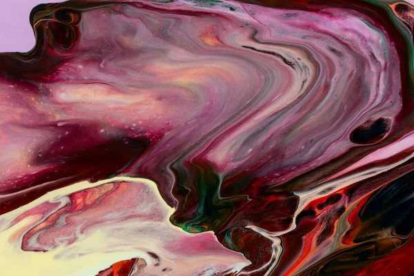 Abstract background of acrylic paint in red and purple tones