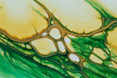 Yeşil ve sarı tonlarda akrilik boyanın soyut arkaplanı