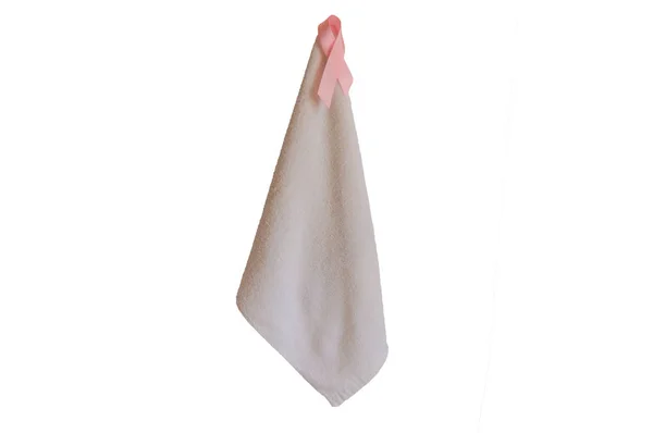 Fita rosa em uma toalha, o símbolo da consciência contra o câncer de mama, isolado no fundo branco — Fotografia de Stock