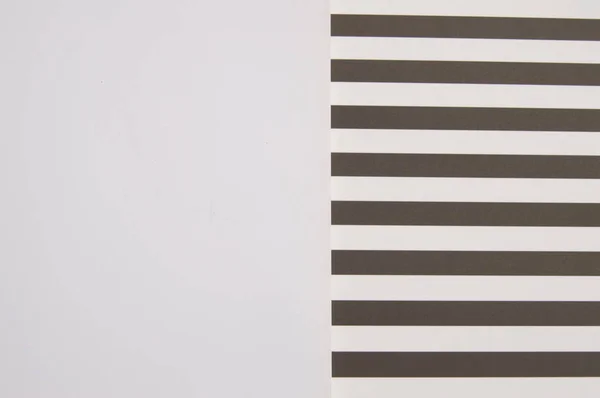 Black and white striped background and white background side by side, abstraction and geometry