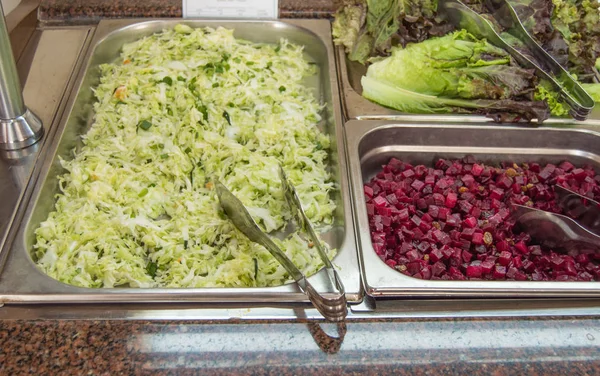 Fresh salad bar with a variety of fresh assortment of VEGETABLE ingredients, a variety of vegetable set for customers to choose from in a supermarket or restaurant — 스톡 사진