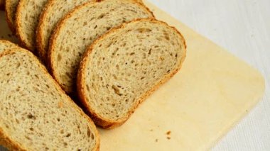 Sliced whole grain bread on table with a tablecloth, ears lie close to, healthy eating, health day