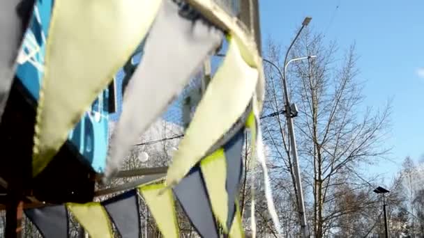 Carnival Decoration Close Selective Focus Wind Slapping Garlands Multicolored Flags — Stockvideo