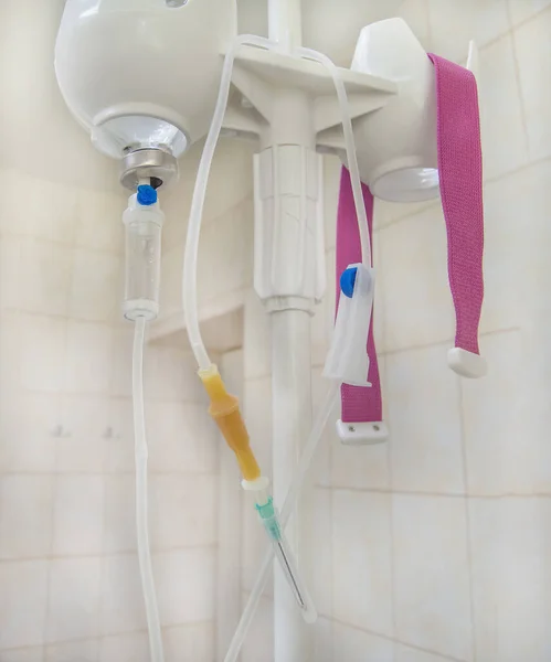 Close-up of an infusion drip in a hospital on a blurry background, a concept of medical care.