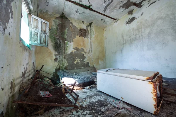 old room destroyed with fridge fall down