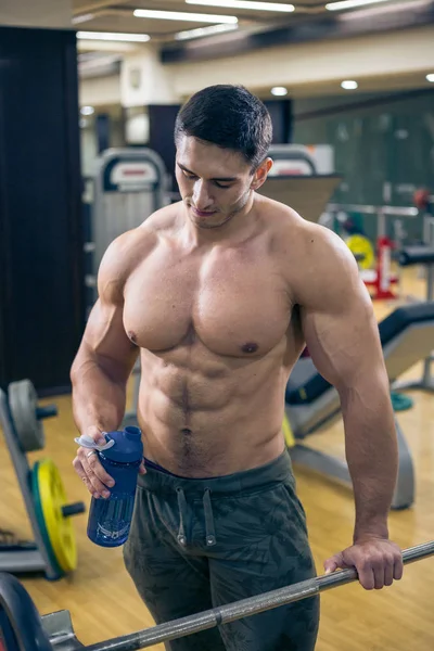 Sexy bodybuilder with Shaker. fun in the gym. healthy lifestyle. — Stock Photo, Image