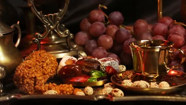 Traditional Oriental Sweets on Vintage Moroccan Tray. Cup of Saffron Masala Tea with indian spices — Stock video