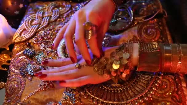 Golden Oriental Jewelry and Accessories: Female Hands with Jewellery and Mirror. — Stock Video