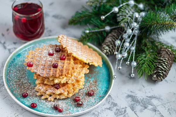 Traditional Belgian waffles with fresh fruits, sprinkled with powdered sugar and cocoa. You can eat for breakfast with compote or coffee. Holiday breakfast. Copy space