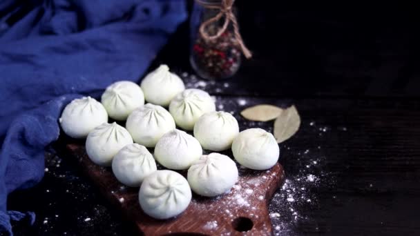 Frozen Raw Henkali Spinach Lie Wooden Board Sprinkle Flour Top — Stock Video