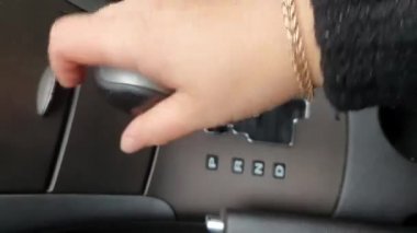 Gear shift knob in a car with automatic transmission.