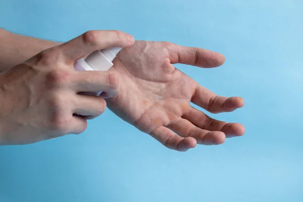 A man washes his hands with soap and uses an antiseptic to clean and disinfect his hands. Virus Prevention, Coronovirus. Hygiene concept hand detail. Purity.