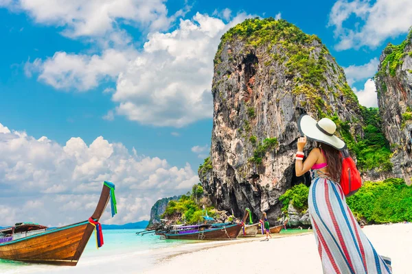 Lifestyle traveler woman stand on famous beach look joy beautifu — Stock Photo, Image