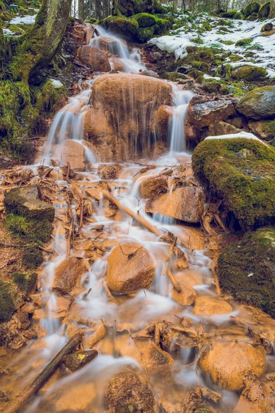 Red rocks waterfall in Latvia. - Stock Image - Everypixel