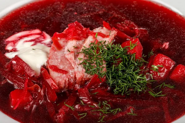 Traditional Ukrainian borsch with sour cream — Stock Photo, Image