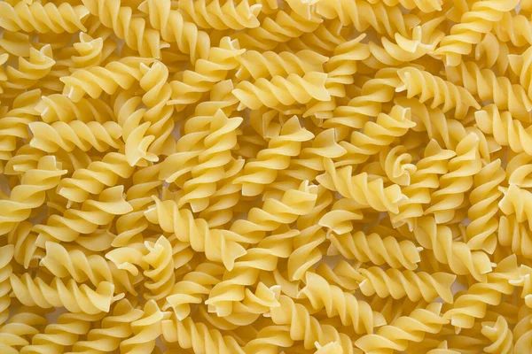 Pişmemiş Fusilli Makarna Arkaplanı — Stok fotoğraf