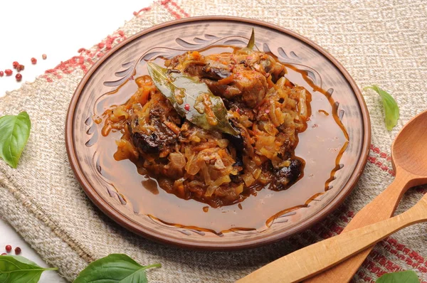 A hearty meal of cabbage, stewed with pork ribs. Ready-made home-cooked dish. — Stock Image A hearty meal of cabbage, stewed with pork ribs. Ready-made home-cooked dish. Stock Photo