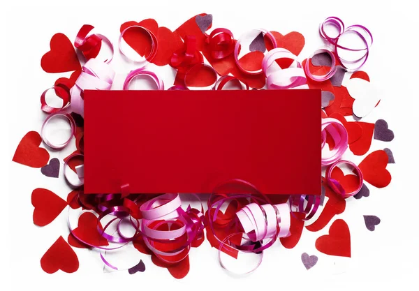 Creative layout made of colored paper hearts and rectangular scrap of paper placed in the center. Valentine with place for text. Celebration concept. — Stock Photo, Image