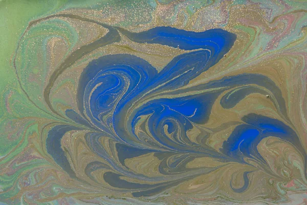 Green and blue liquid texture. Hand drawn marbling background. Ink marble abstract pattern