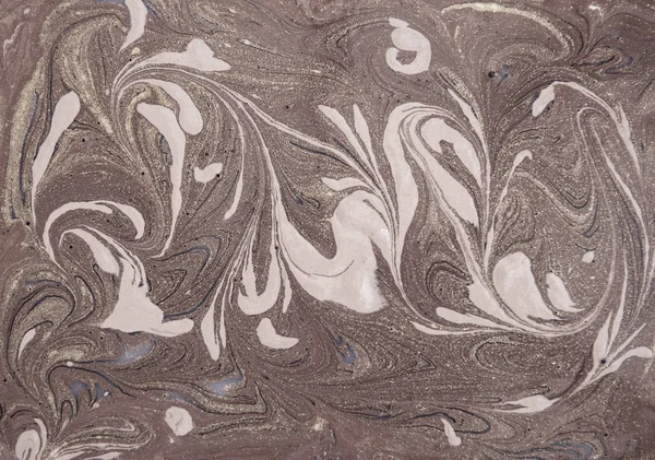 Liquid gold marbled pattern. Beige background