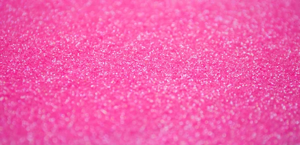 Blur pink sparkle background. Defocused glitter texture