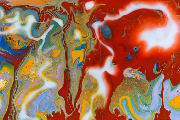 Blue, red and yellow fluid art abstract texture. Mixed acrylic inks drops.