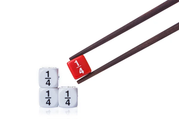 Three white quarter fraction dices on white table and red quarte — Stock Photo, Image