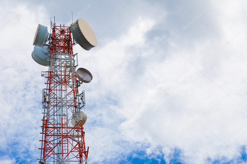 Telecommunication tower against clody blue sky