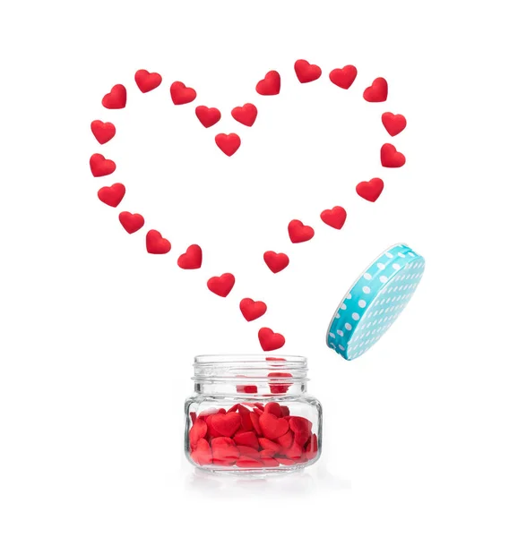 Red hearts flying out of glass jar forming big heart shape — Stock Photo, Image