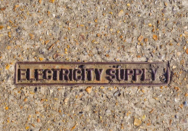 Electricity Supply sign on foot path of London, England